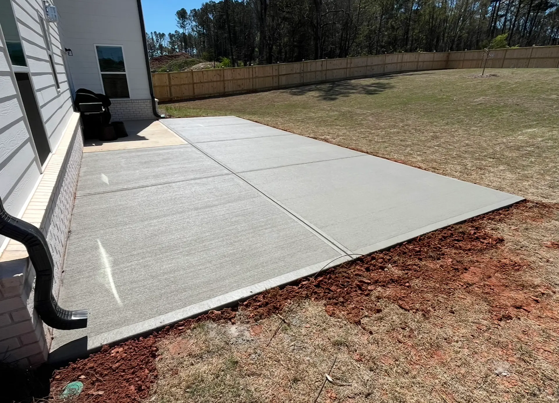 Freshly poured structural concrete slab by Mind & Vision Construction
